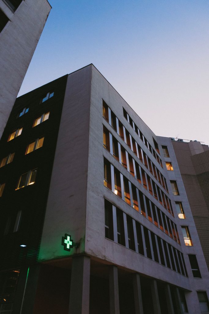 Low-angle exterior view of a modern hospital building